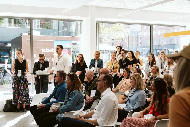 Guests listening in the Polestar showroom.