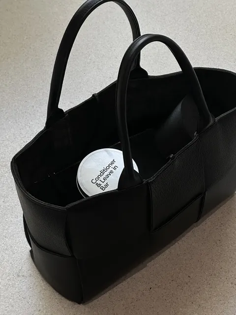Close-up of a conditioner bar in a handbag