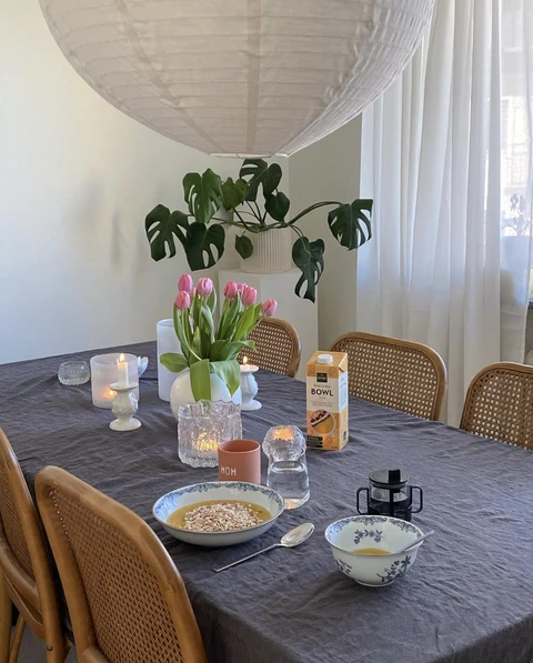 Breakfast table with tulips and a Kiviks Bowl carton
