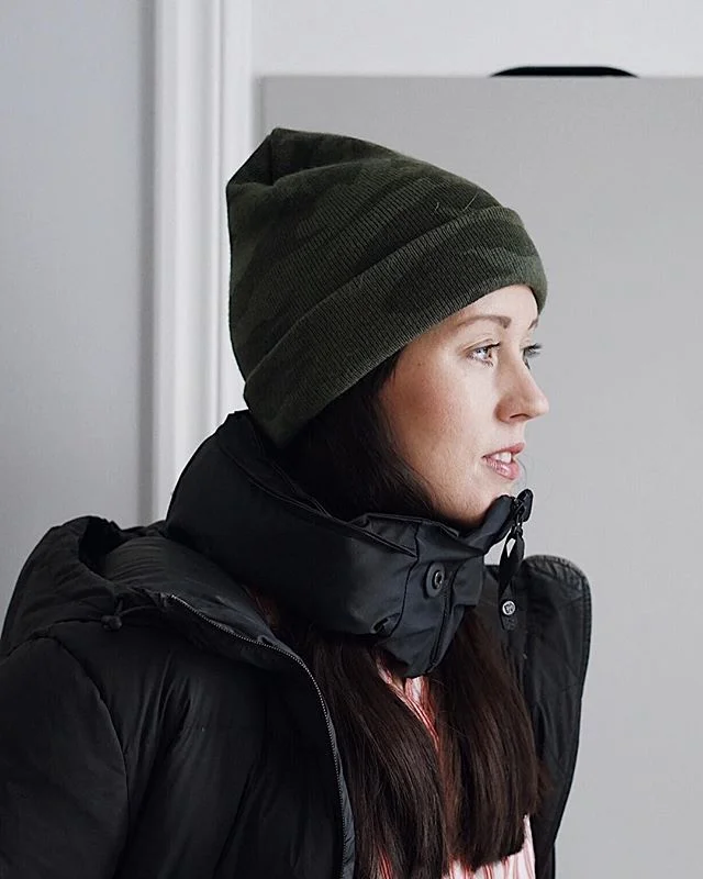 Portrait with a green hat and black jacket