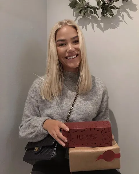 Creator holding a gift box