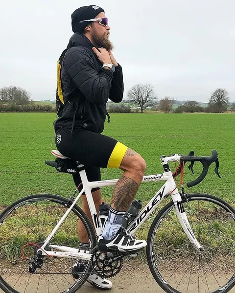 Cyclist beside a country road