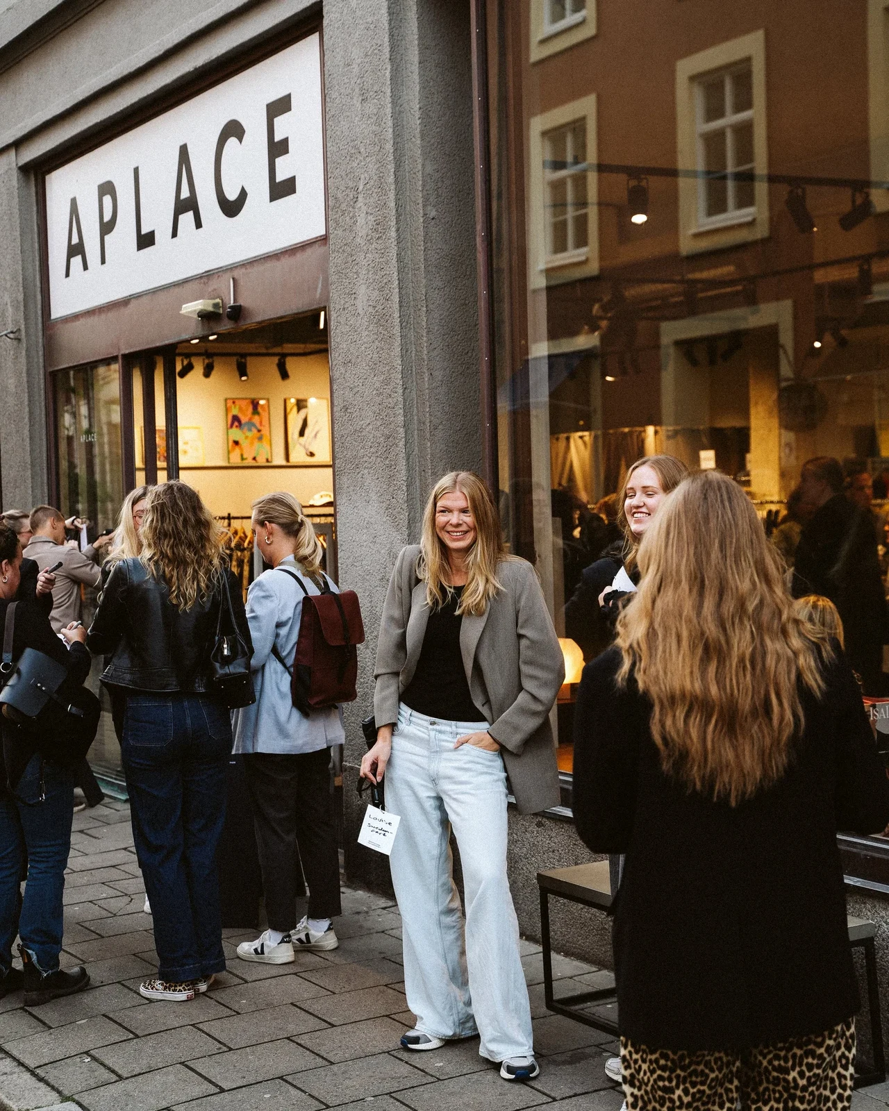 Event guests gathering outside Aplace.