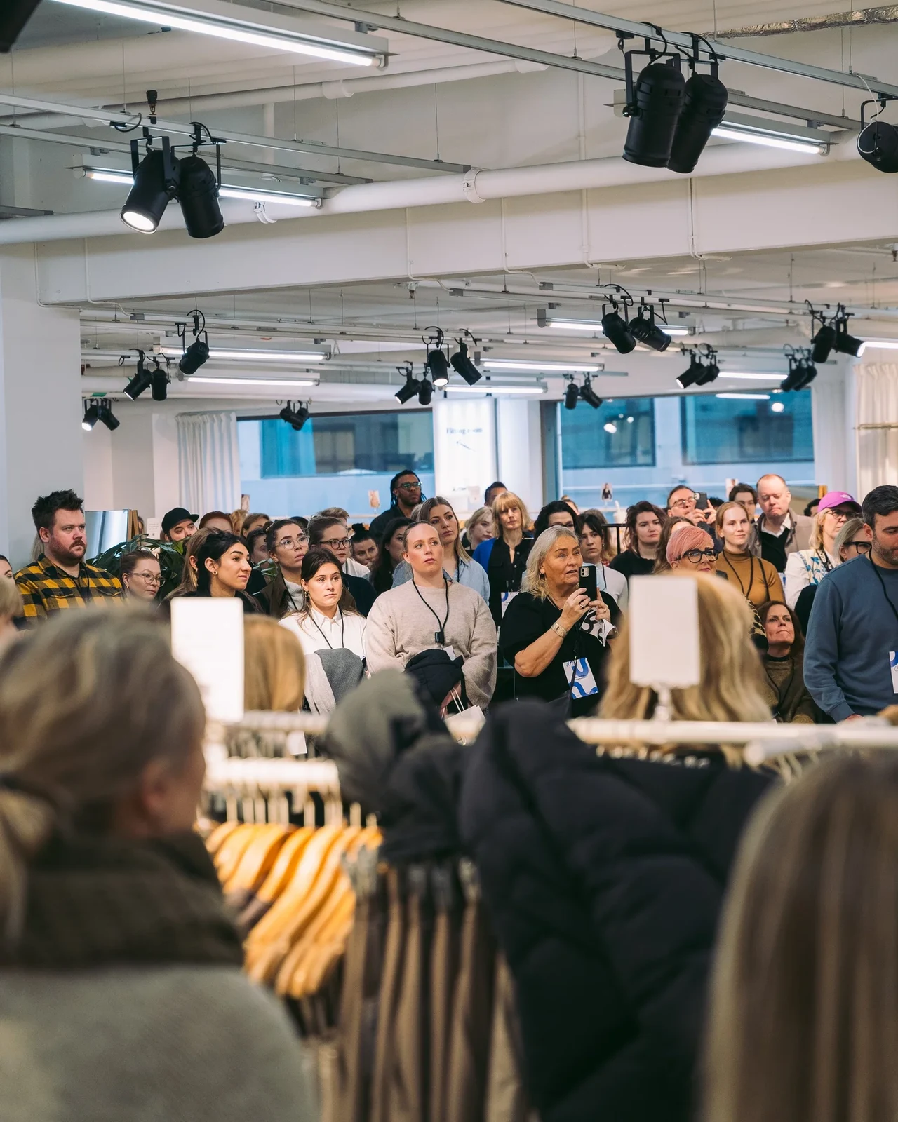 The audience listening to a speaker inside & Other Stories.