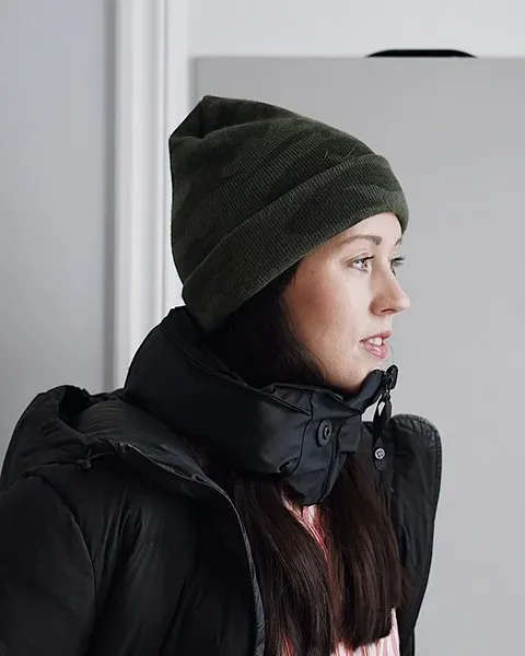 Portrait with a green hat and black jacket