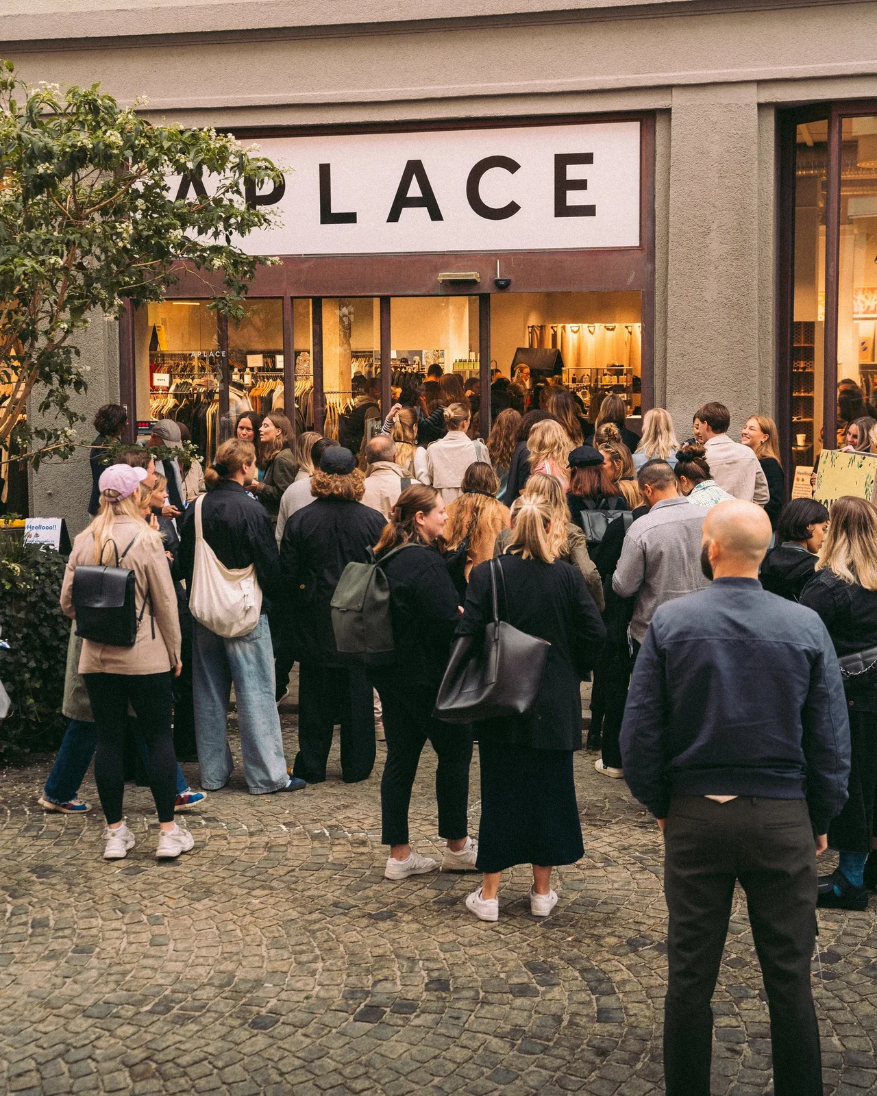 Event guests gathering outside Aplace.