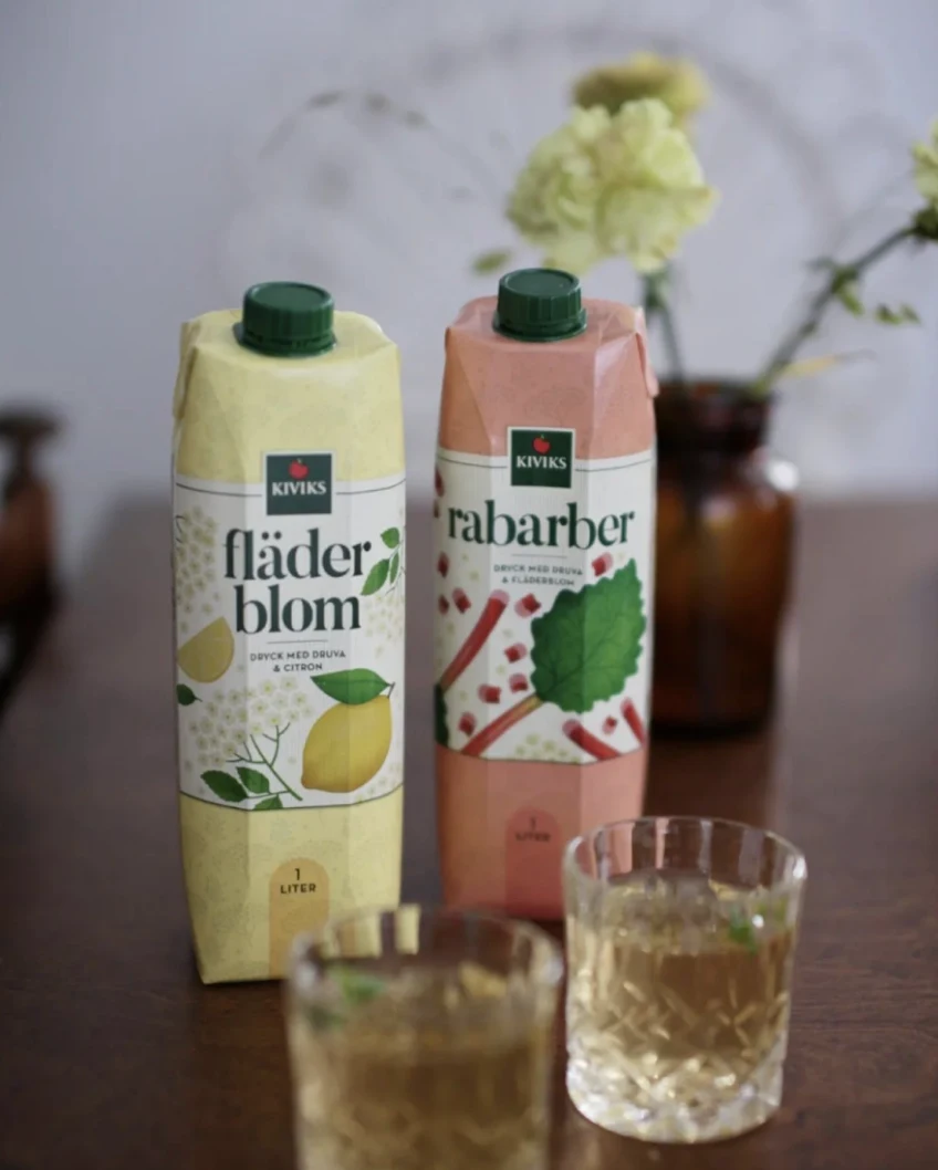 Kiviks elderflower and rhubarb drinks with glasses on a table