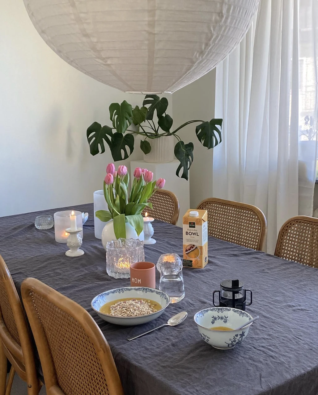 Breakfast table with tulips and a Kiviks Bowl carton
